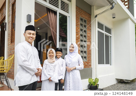Portrait of the Indonesian Muslim family celebrating Eid Mubarak. Concept of Happy Lebaran, Eid Al Fitr, Idul Fitri, and Ramadan Mubarak celebration Portrait of the Indonesian Muslim family celebrating Eid Mubarak. Concept of Happy Lebaran, Eid Al Fitr, Idul Fitri, and Ramadan Mubarak celebration 124148149