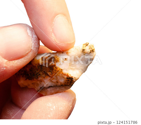 Man hands holding semi precious stone mineral, isolated on a white background 124151786