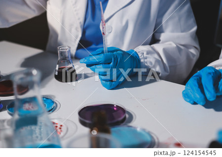 Researchers working in the clinical laboratory 124154545