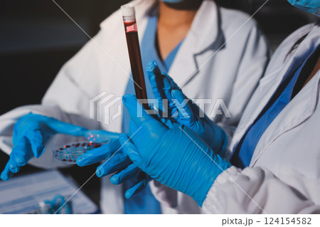 Researchers working in the clinical laboratory Researchers working in the clinical laboratory 124154582