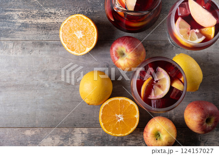 Refreshing Summer Citrus Fruit Sangria in crystal jar on wooden table 124157027