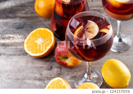 Refreshing Summer Citrus Fruit Sangria in crystal jar on wooden table Refreshing Summer Citrus Fruit Sangria in crystal jar on wooden table 124157059