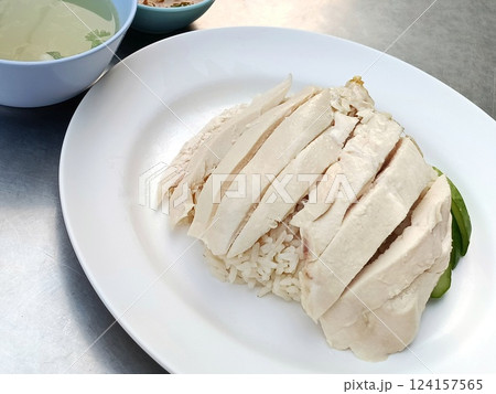 Traditional Chicken Rice or Steamed rice topped with chicken. Traditional Chicken Rice or Steamed rice topped with chicken. 124157565