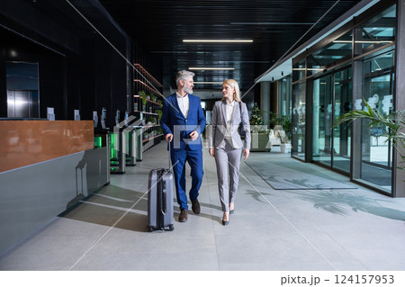 Business owner meeting a partner in the airport and going to the exit 124157953