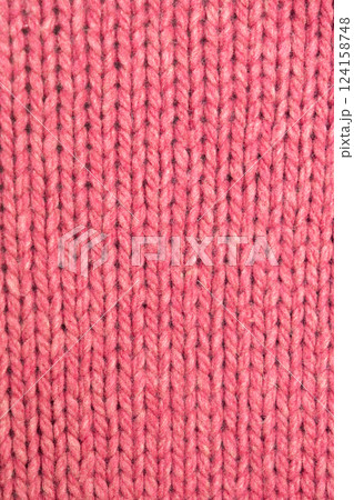 knitted texture, pink fuchsia sweater or carpet, pattern of back loops and front. 124158748