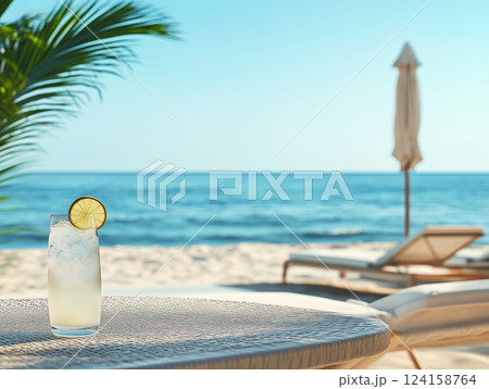 リゾートの浜辺と赤いロングカクテルのイメージ 124158764