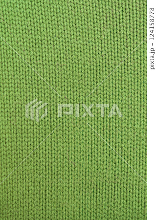 knitted texture, bright green sweater or carpet, pattern of the back and front loops. knitted texture, bright green sweater or carpet, pattern of the back and front loops. 124158778