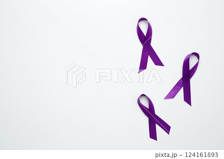 Purple Epilepsy Awareness Day, purple ribbon held, symbol of support Purple Epilepsy Awareness Day, purple ribbon held, symbol of support 124161893