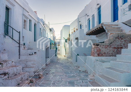 Folegandros alleyway, whitewashed buildings, blue doors, stone steps. Folegandros alleyway, whitewashed buildings, blue doors, stone steps. 124163844