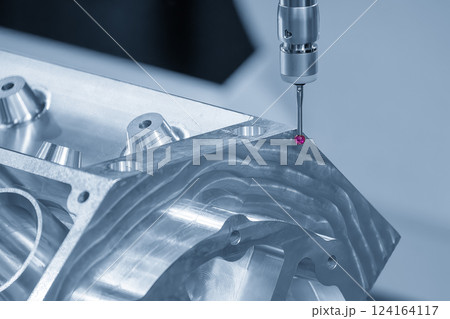 The multi axis CMM machine measuring the aluminum cylinder head parts in the light blue scene. The multi axis CMM machine measuring the aluminum cylinder head parts in the light blue scene. 124164117