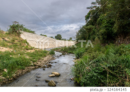 The riverbank of Ylang Ylang River in Cavite, Philippines at a low water level The riverbank of Ylang Ylang River in Cavite, Philippines at a low water level 124164145