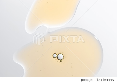 Textured background of cosmetic moisturizing gel or skin serum Textured background of cosmetic moisturizing gel or skin serum 124164445