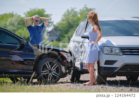 Drivers of smashed vehicles arguing who is guilty in car crash accident on street side. Road safety and insurance concept Drivers of smashed vehicles arguing who is guilty in car crash accident on street side. Road safety and insurance concept 124164472