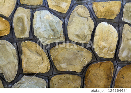 Different sizes of sand stones. Stone wall pattern background Different sizes of sand stones. Stone wall pattern background 124164484