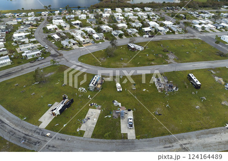 Destroyed RV camper vans and and mobile homes after hurricane in Florida residential area. Consequences of natural disaster Destroyed RV camper vans and and mobile homes after hurricane in Florida residential area. Consequences of natural disaster 124164489