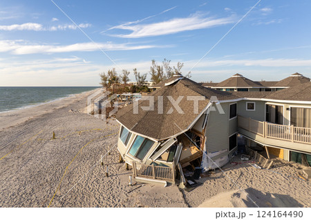 Destroyed houses on ocean shore after hurricane Milton landfall. Natural disaster consequences on Manasota Key, Florida. Storm surge severe damage 124164490