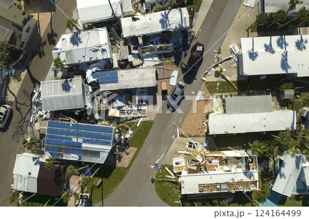 Destroyed by strong hurricane winds suburban houses in Florida mobile home residential area. Consequences of natural disaster 124164499