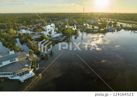 Consequences of natural disaster. Heavy flood with high water surrounding residential houses after hurricane Ian rainfall in Florida residential area Consequences of natural disaster. Heavy flood with high water surrounding residential houses after hurricane Ian rainfall in Florida residential area 124164523