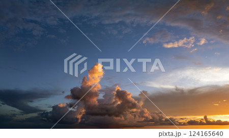 Bright colorful orange and yellow clouds on horizon. Beautiful sunset sky scenery Bright colorful orange and yellow clouds on horizon. Beautiful sunset sky scenery 124165640