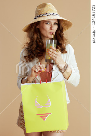 smiling elegant woman in blouse and shorts smiling elegant woman in blouse and shorts 124165725