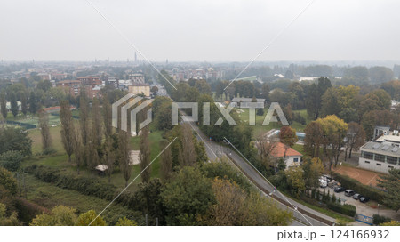 Aerial view of cremona showing the cityscape and parkland along the po river in lombardy, italy 124166932