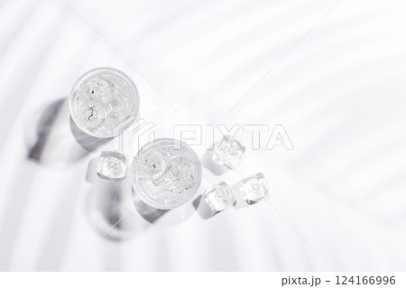 Crystal-clear glasses filled with chilled water and ice cubes 124166996