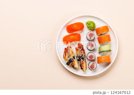 Assorted sushi and maki rolls beautifully arranged on plate 124167012