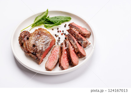 A perfectly cooked sliced striploin steak with a juicy, tender texture A perfectly cooked sliced striploin steak with a juicy, tender texture 124167013
