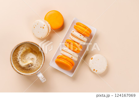 A delightful combination of freshly brewed coffee and delicate macaroons A delightful combination of freshly brewed coffee and delicate macaroons 124167069