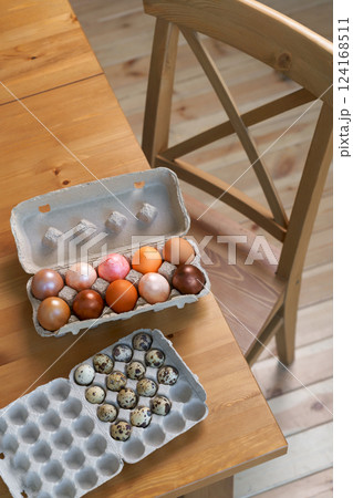 Three Boxes Of Eggs Are Sitting On A Wooden Table 124168511