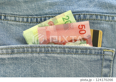 canadian money in jeans pocket 124170266
