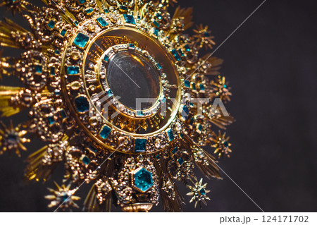 Gold rosette with emeralds from Christianity in shape of crown, medieval jewelry 124171702