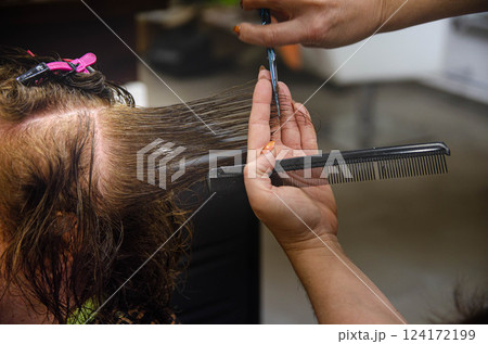Hairdresser Cutting Wet Hair Salon Scene copy space , banner 124172199