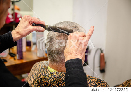 Professional Barber Cutting Senior Mans Hair in Classic Salon,banner ,campaing  124172235