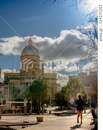 Historic Dome Church in city Kalkara country Malta with Jogger on a Sunday Historic Dome Church in city Kalkara country Malta with Jogger on a Sunday 124172261