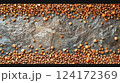 Buckwheat Seeds on Textured Stone Background Buckwheat Seeds on Textured Stone Background 124172369