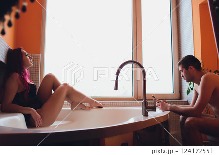 A Romantic Bath Scene Depicting a Loving Couple in a Stylish and Modern Bathroom Setting 124172551