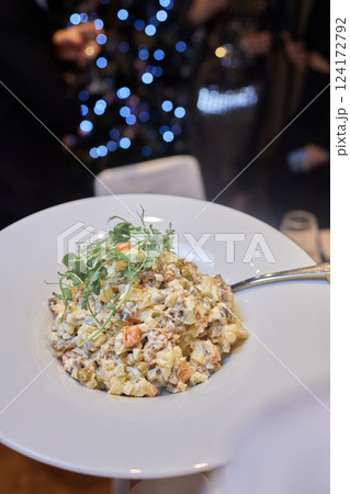 An elegant pasta dish expertly served at a fine dining restaurant, offering a unique experience 124172792