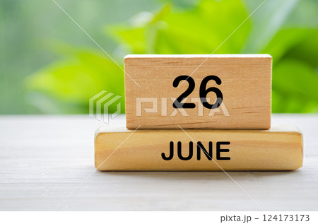 26 June wooden calendar with customizable space for text or ideas. June month concept. 124173173