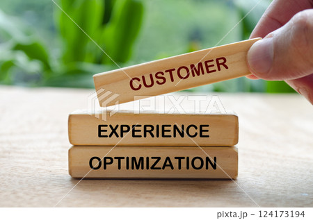 Customer Experience Optimization text on wooden blocks. Customer retention concept Customer Experience Optimization text on wooden blocks. Customer retention concept 124173194