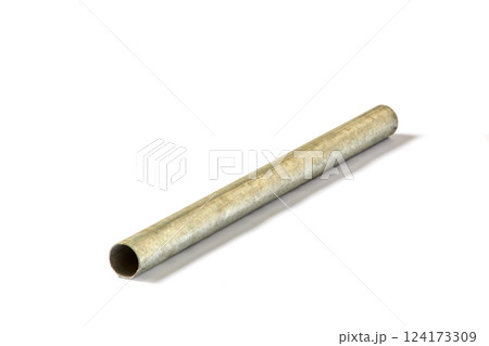 A Close-Up View of a Single Cardboard Cylinder on a White Background, Illustrating Simple Geometric Shapes and Functional Design in Everyday Objects for Various Applications A Close-Up View of a Single Cardboard Cylinder on a White Background, Illustrating Simple Geometric Shapes and Functional Design in Everyday Objects for Various Applications 124173309