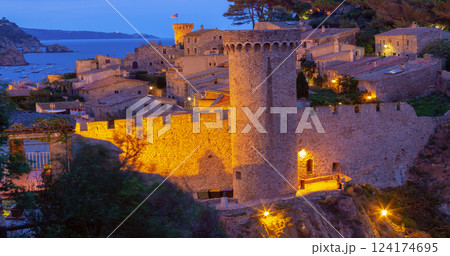 Tossa de Mar, Spain, illuminated medieval town at dawn Tossa de Mar, Spain, illuminated medieval town at dawn 124174695