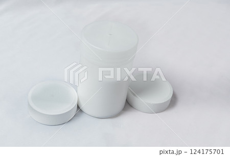 Chlorine tablets for swimming pool disinfection on white background, swimming pool cleaning and maintenance chlorine tablets. Chlorine tablets for pool cleaning on isolated background 124175701