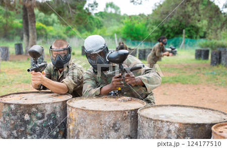 Portrait of two confident male paintball players in masks 124177510