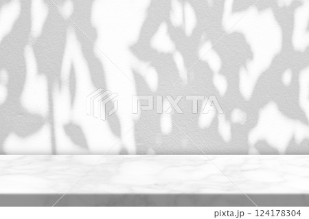 White Marble Table with Tree Shadow on Concrete Wall Texture Background White Marble Table with Tree Shadow on Concrete Wall Texture Background 124178304