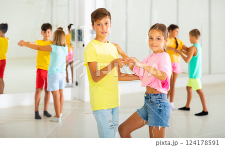 Active young children enjoying of partner dance in class 124178591