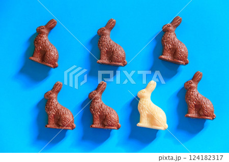 Easter chocolate bunnies on blue background. Top view Easter chocolate bunnies on blue background. Top view 124182317