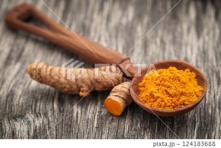 Raw turmeric with powder Raw turmeric with powder 124183688
