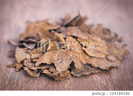 Dry tobacco leaves Dry tobacco leaves 124184140
