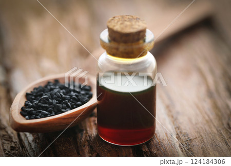 Nigella seeds and essential oil Nigella seeds and essential oil 124184306